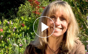 This image shows a preview of the 'What's happening to biodiversity' video and includes a still shot of presenter Michaela Strachan. There is a white play button in the middle ready to be clicked to launch the video.